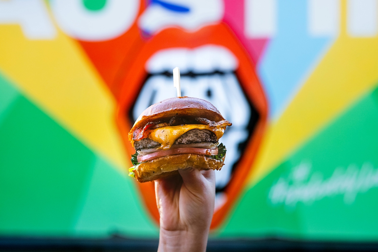 Hopdoddy burger in front of Austin mural