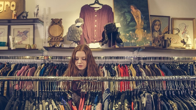 woman shopping at clothing rack