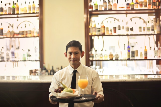 waiter holding tray