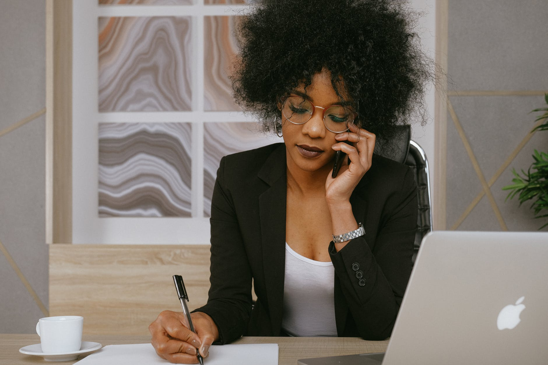 woman offering customer support on phone