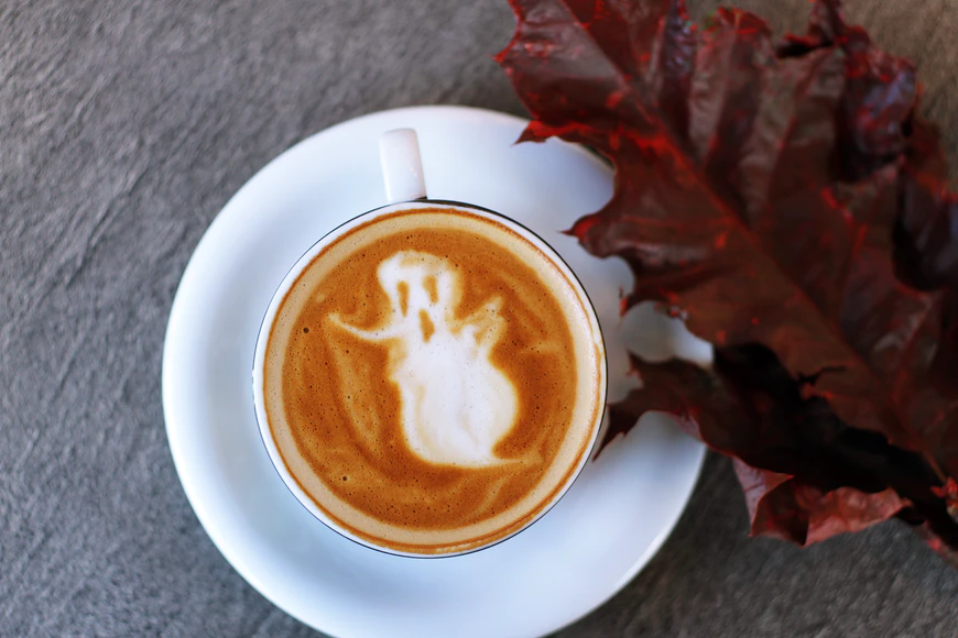 coffee drink with ghost art for october marketing ideas for cafe