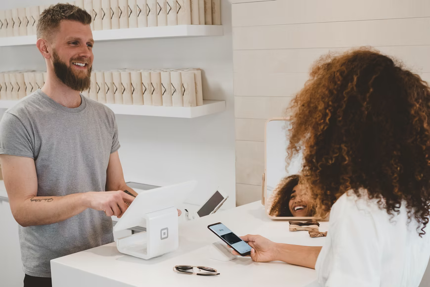 woman paying cashier