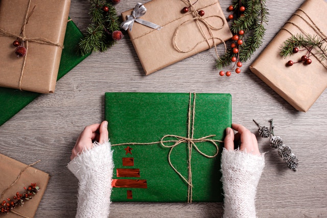 woman wrapping christmas present