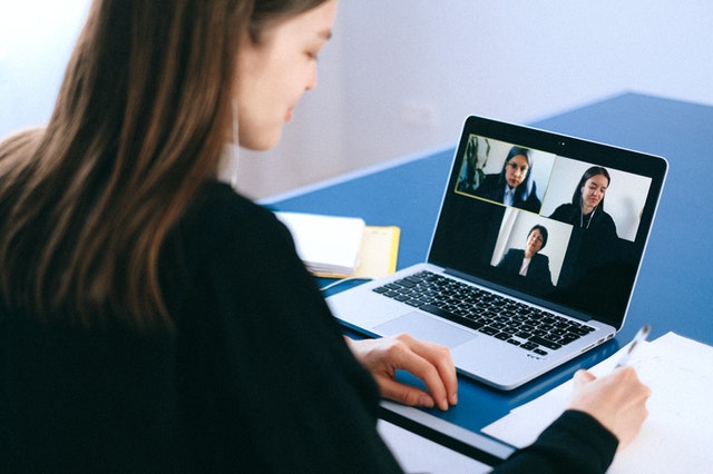 business owner having a video call with team