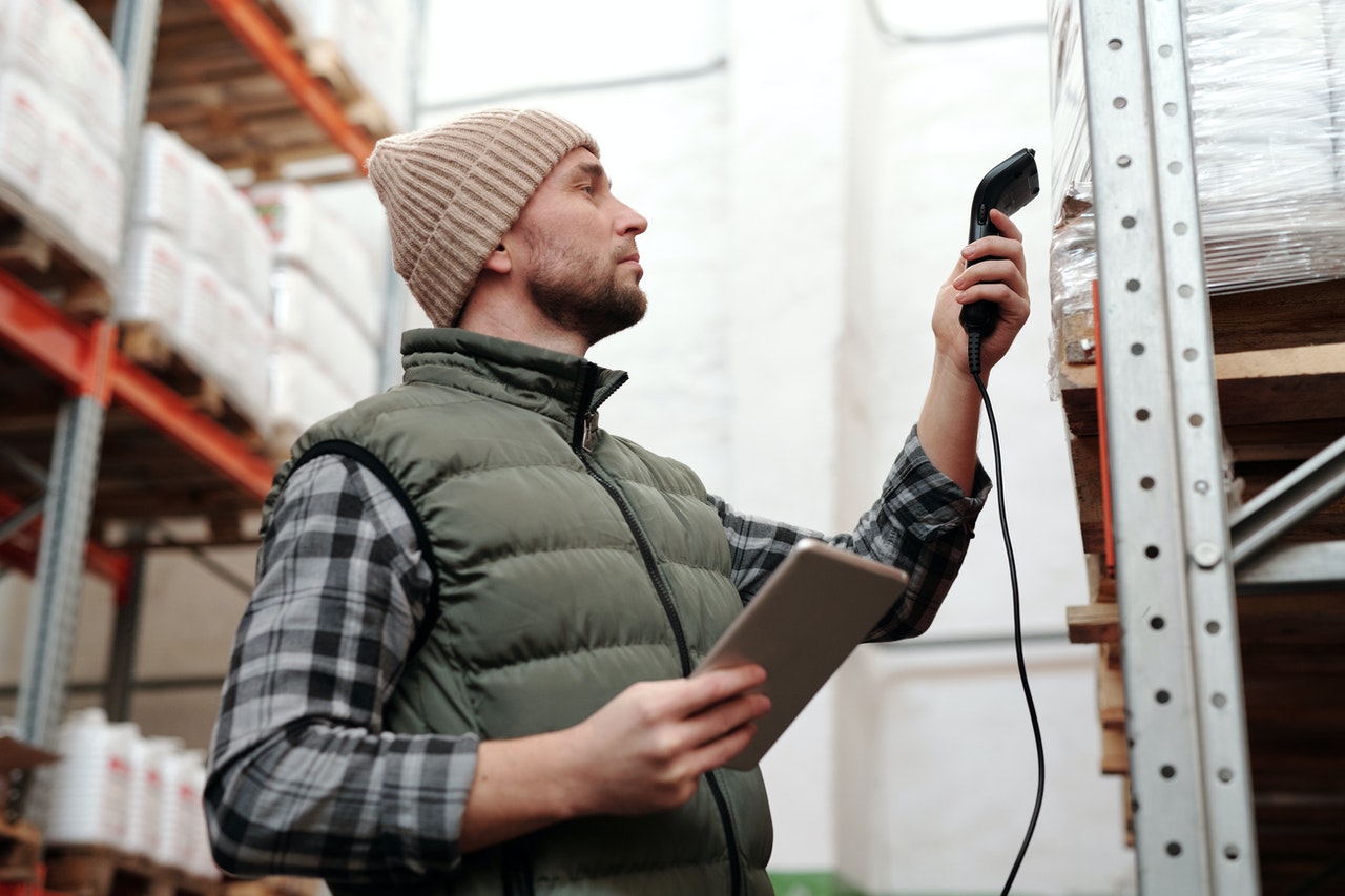 A man tracking inventory with a scanner