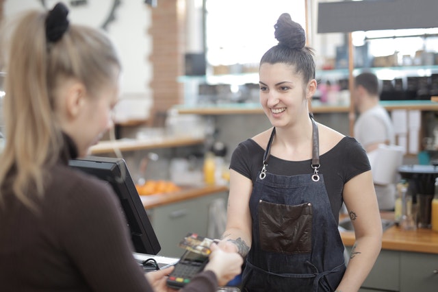 A card being tapped at a point-of-sale system
