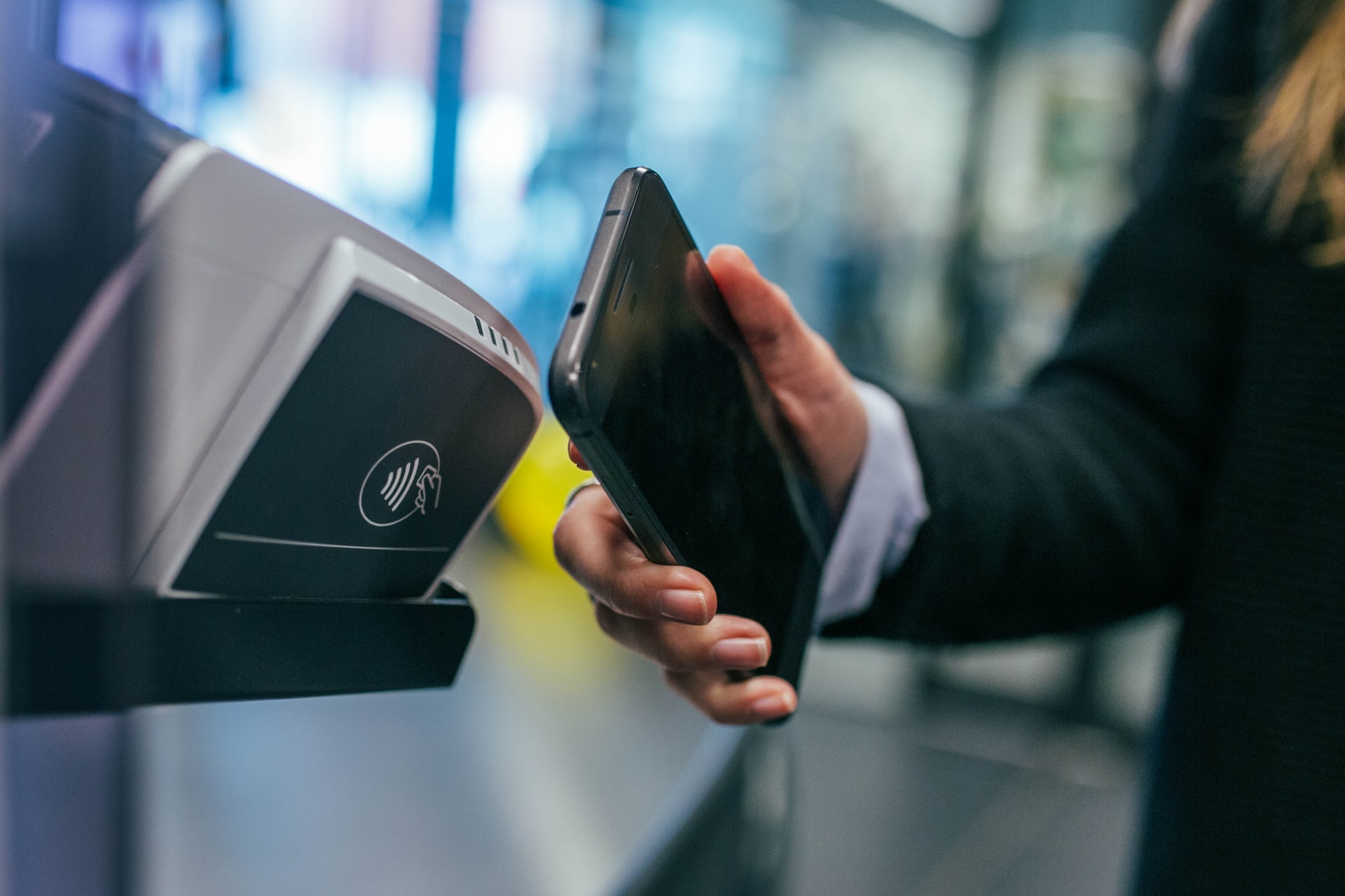 customer paying for purchase with smartphone