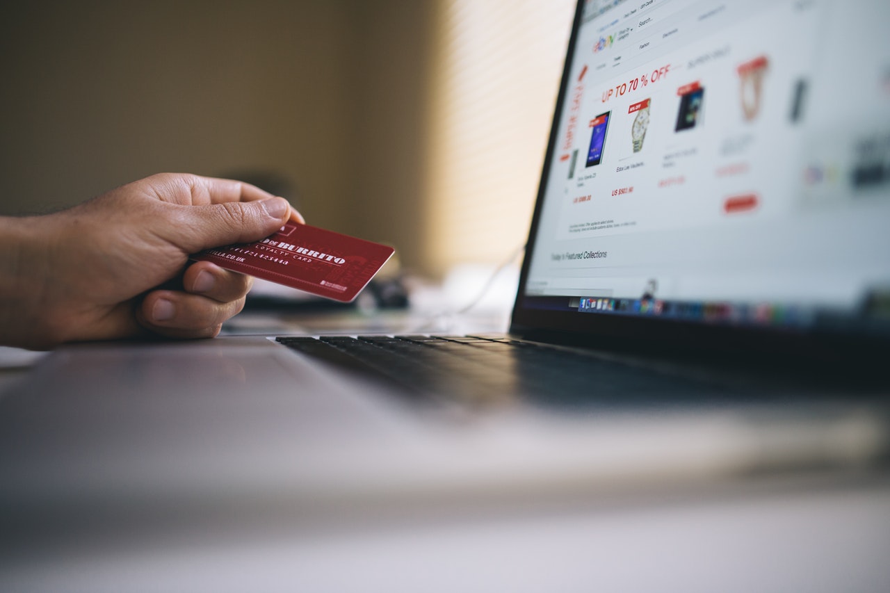 A customer paying for online shopping purchases with a card