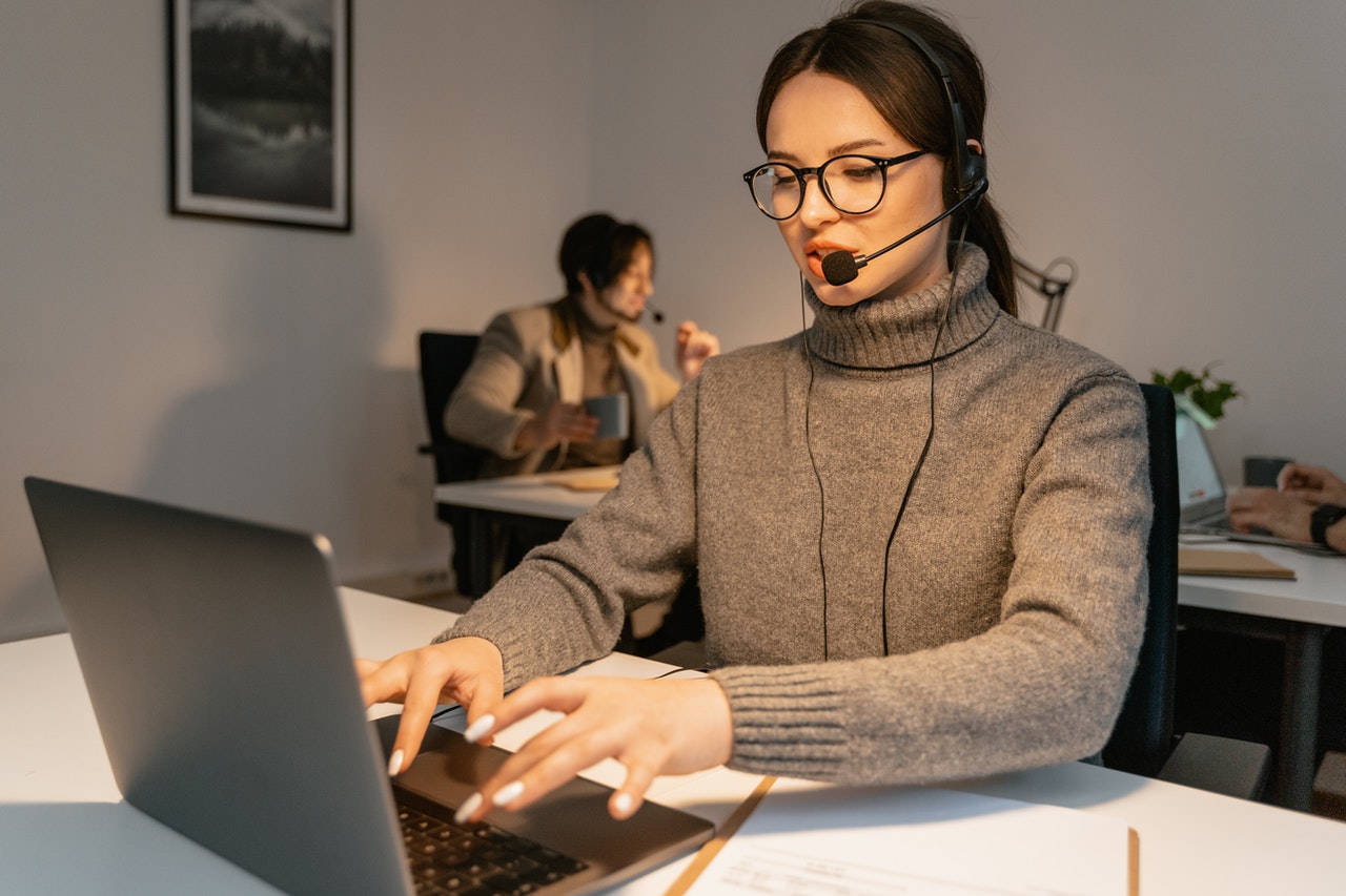 Male and female customer service representatives at work