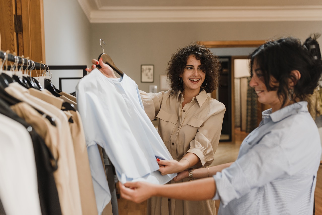 A salesperson helping a loyal customer shop