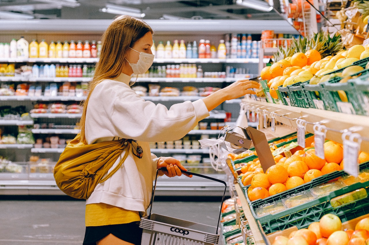 Woman shopping wearing face mask