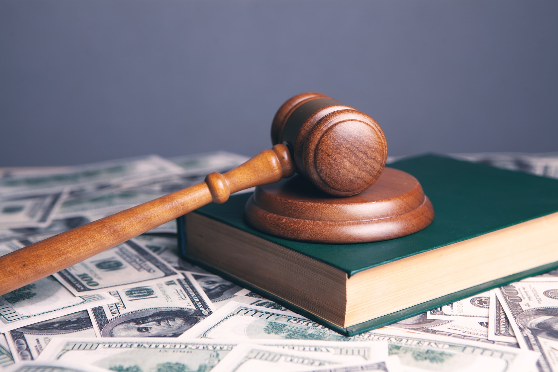 A gavel on top of a law book