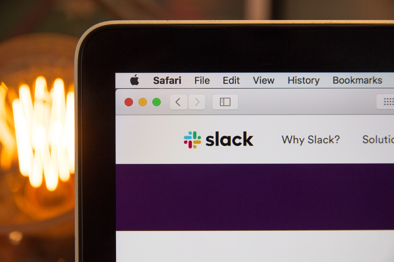 An image of Macbook screen showing Slack UI