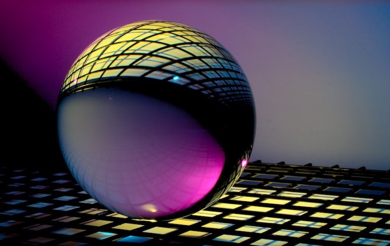 A clear glass sphere reflecting a grid