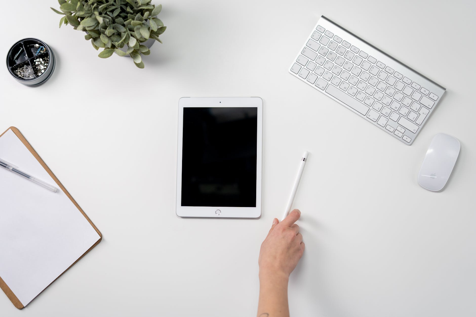 white ipad on white table