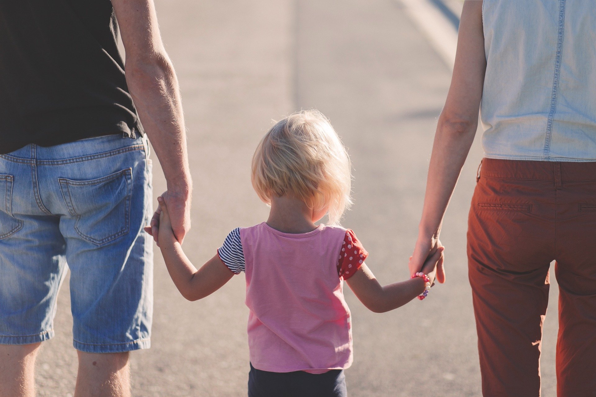 Adults with child discussing Child support laws Wisconsin