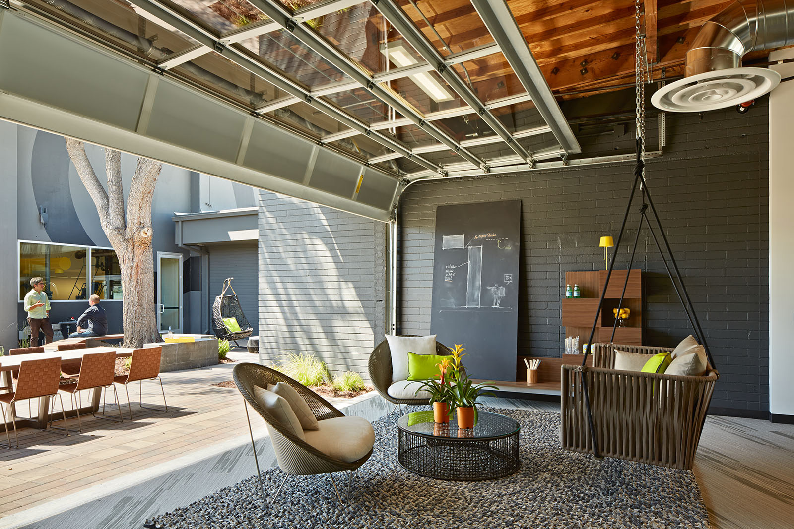 One Workplace - Outdoor office with open garage breakout area