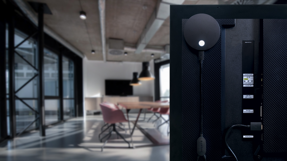 Back of a TV in a conference room showing Airtame 2