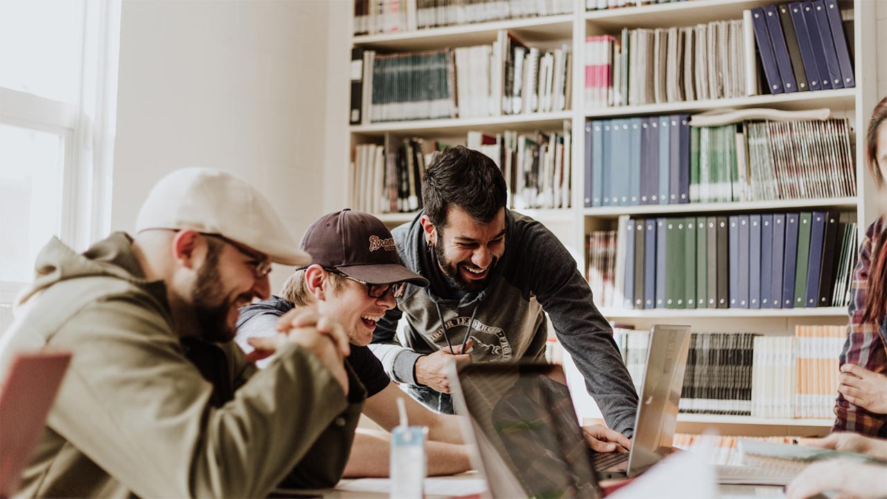 three young professionals collaborating on work