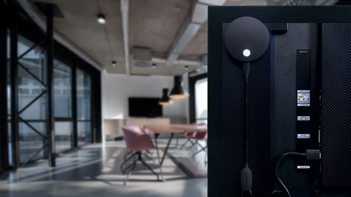 Back of a TV in a conference room showing Airtame 2