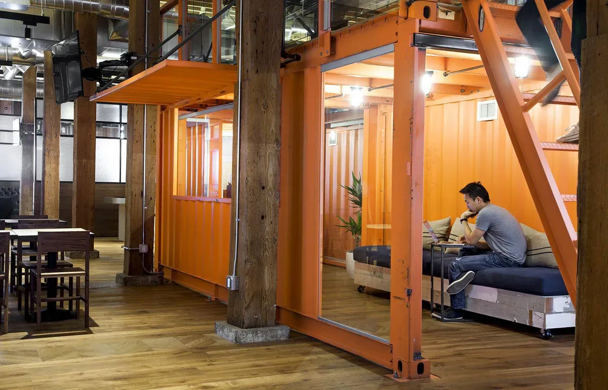 Orange metal container with bench at Github's office