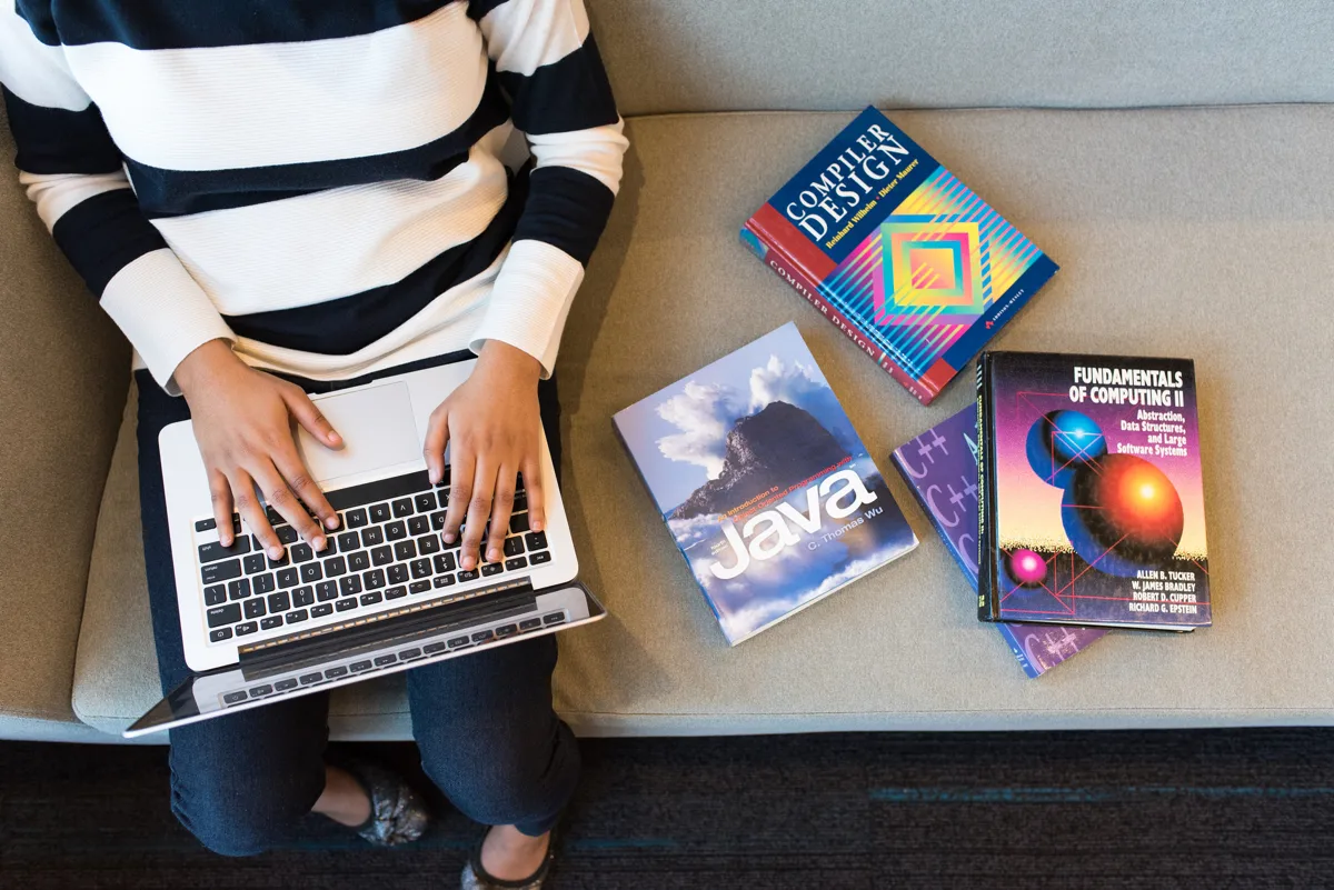 wocintechchat.com - IT Woman studying computer science books