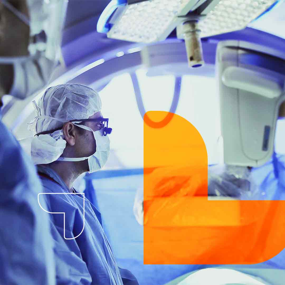 Image of a vascular surgeon performing a minimally-invasive catheter procedure.