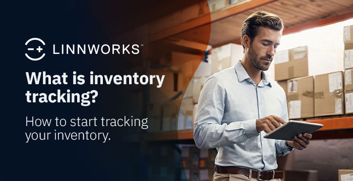 An image of a man in a warehouse tracking inventory with a tablet.
