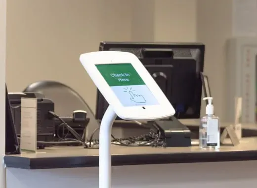 Digital workout machines - A woman working out on a strength training machine.