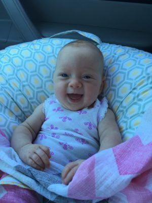 katie baby currently smiling