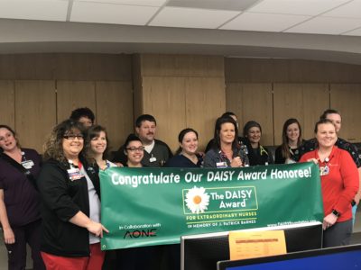 Image of Kelli Jo Bruce, DAISY award recipient with her team.