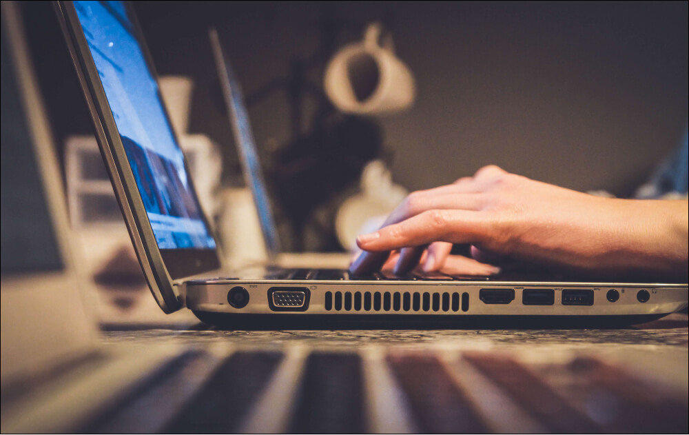 Man typing on laptop