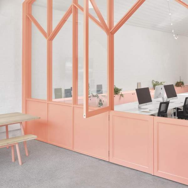 Office space with polished concrete floors and pink walls