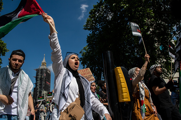 Students march from Downing Street towards the Embassy of Israel as they call for Justice for Palestine on June 12, 2021 