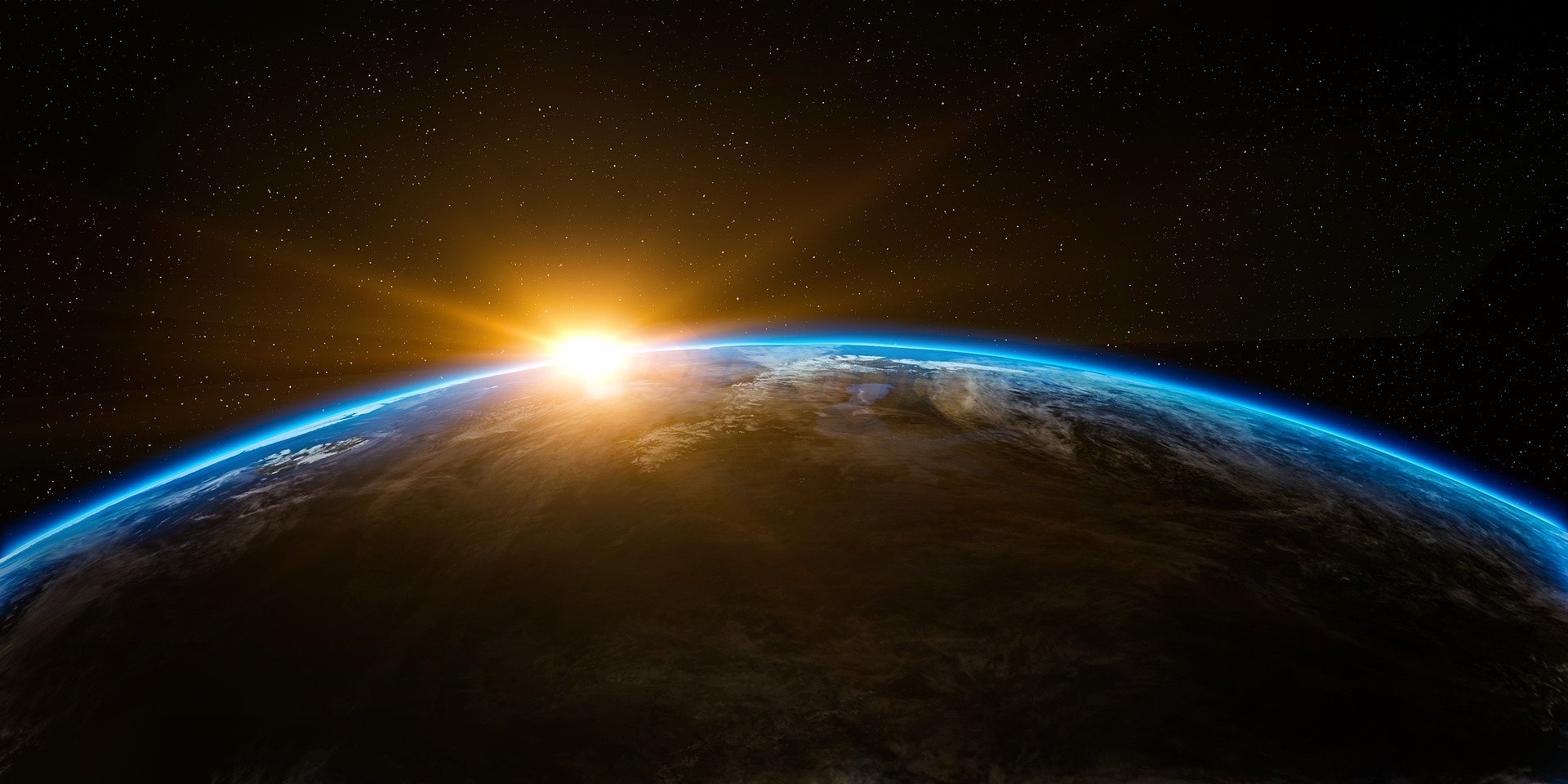 Image showing the sun rising at the edge of the earth