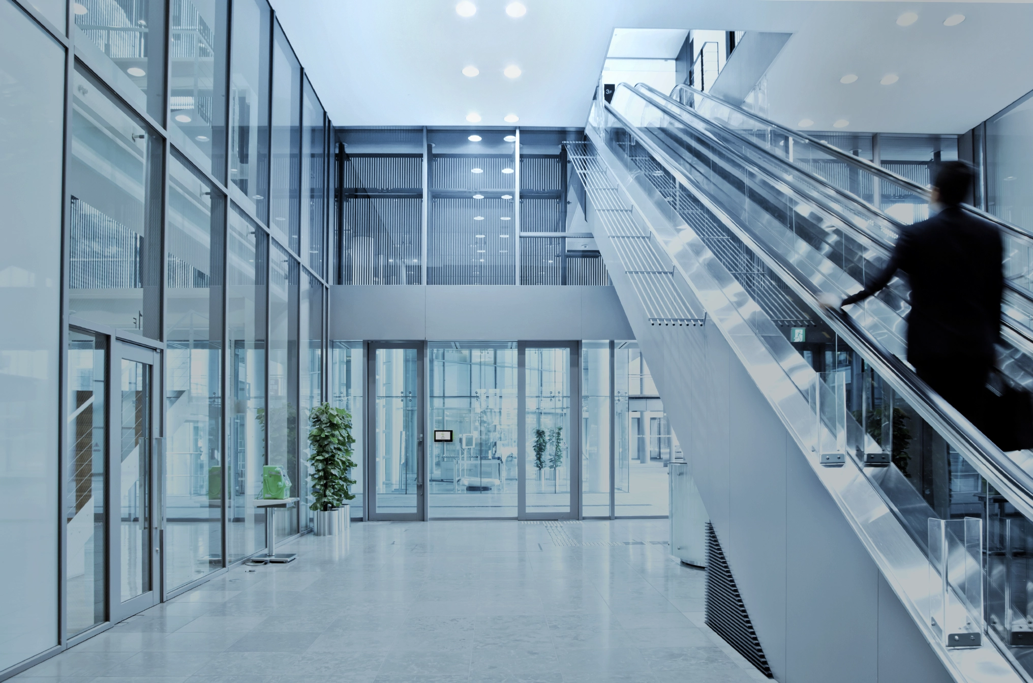 Inside of an office building with an escalator