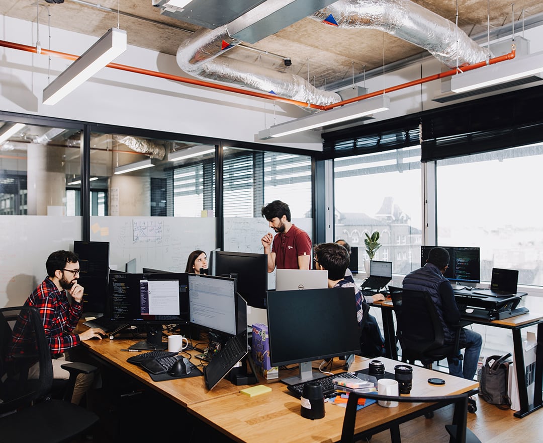 Colleagues working in office space