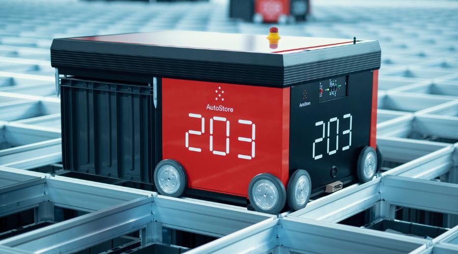 The AutoStore R5 robot carrying a bin