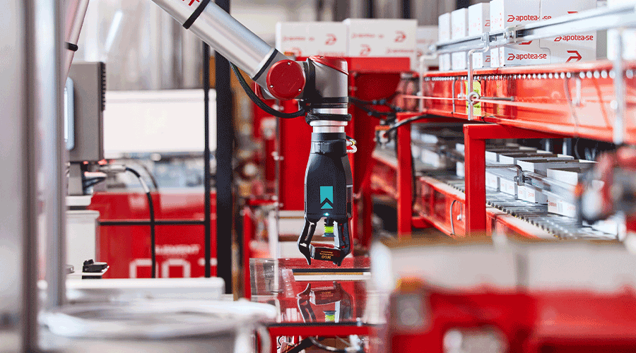 Robotic arm picking items from AutoStore. Image.