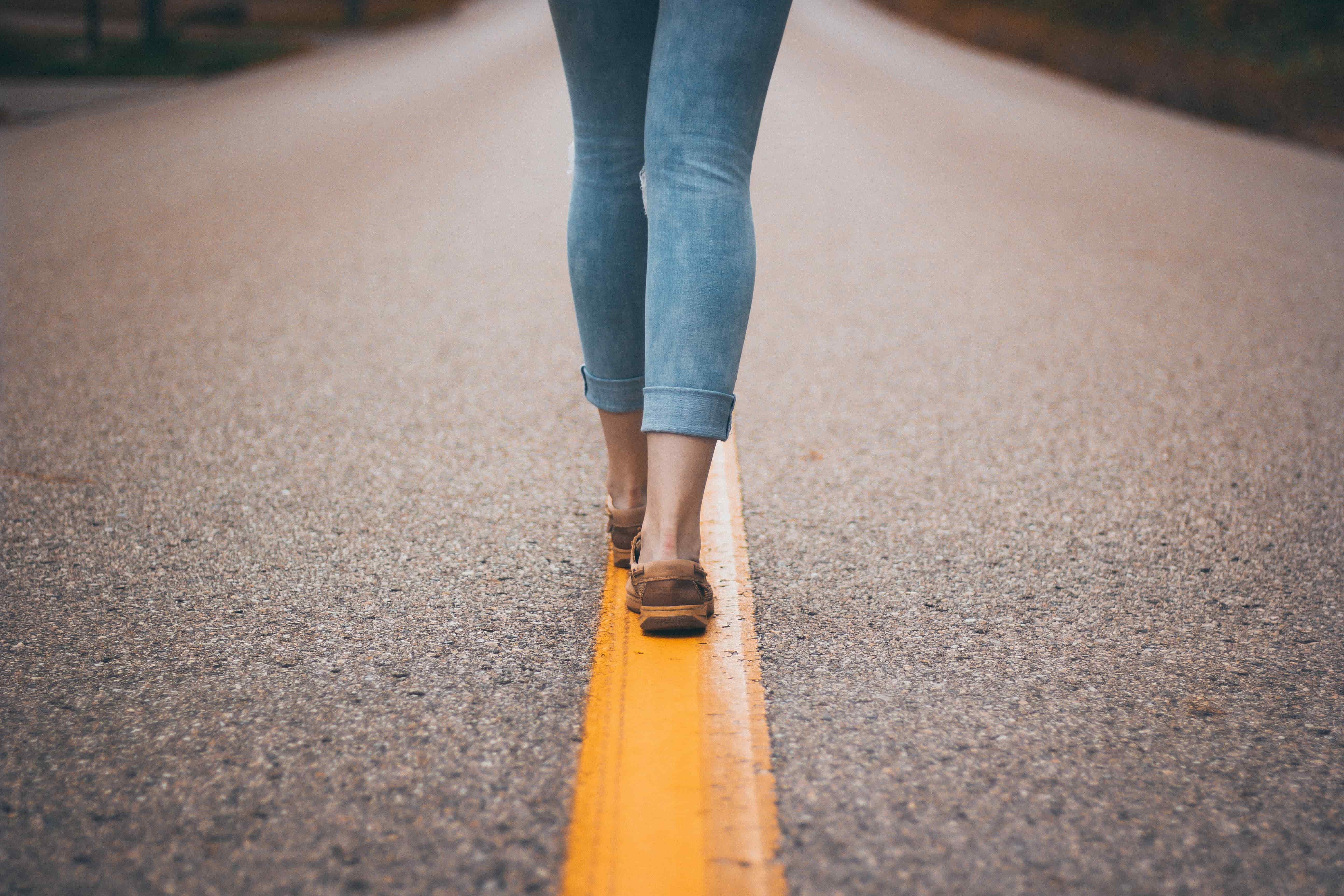 woman walking on a straight, guiding line