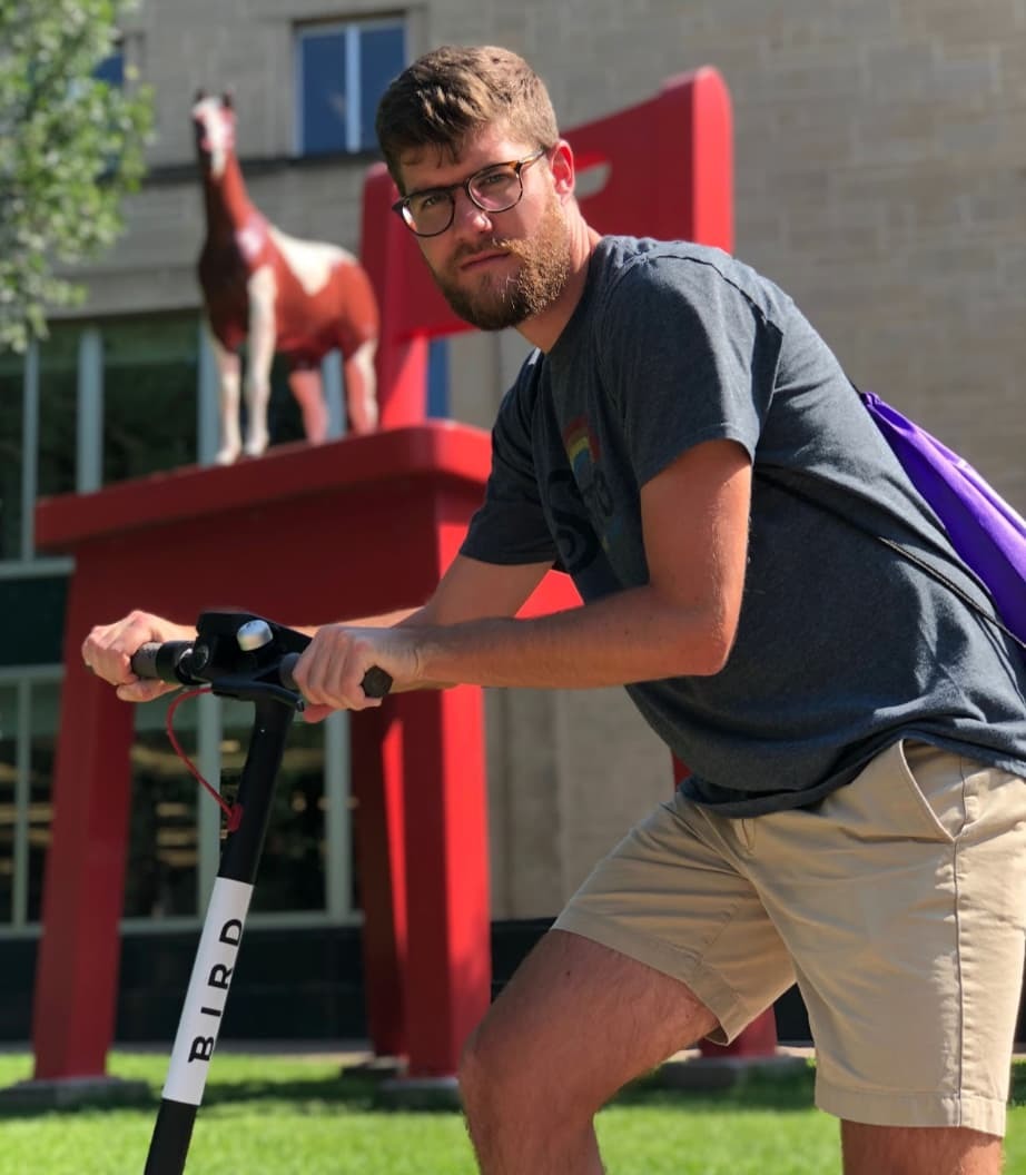 Krit team member on a Scooter