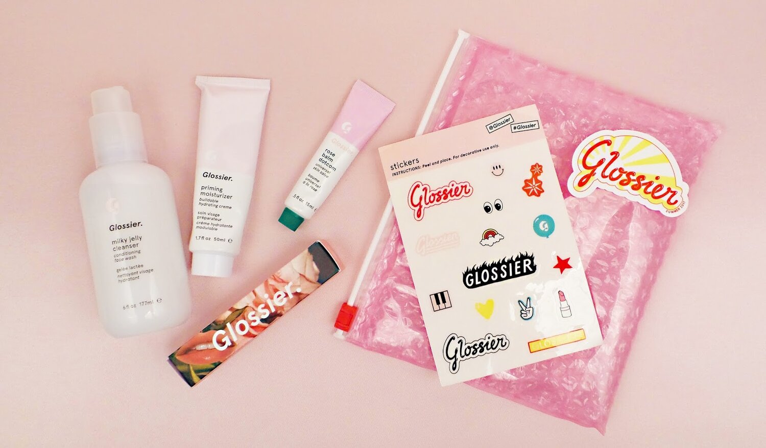 Glossier unboxing experience is fully branded and includes little gifts that feel special + relevant to the target consumer. Source: Peppermintheart.com