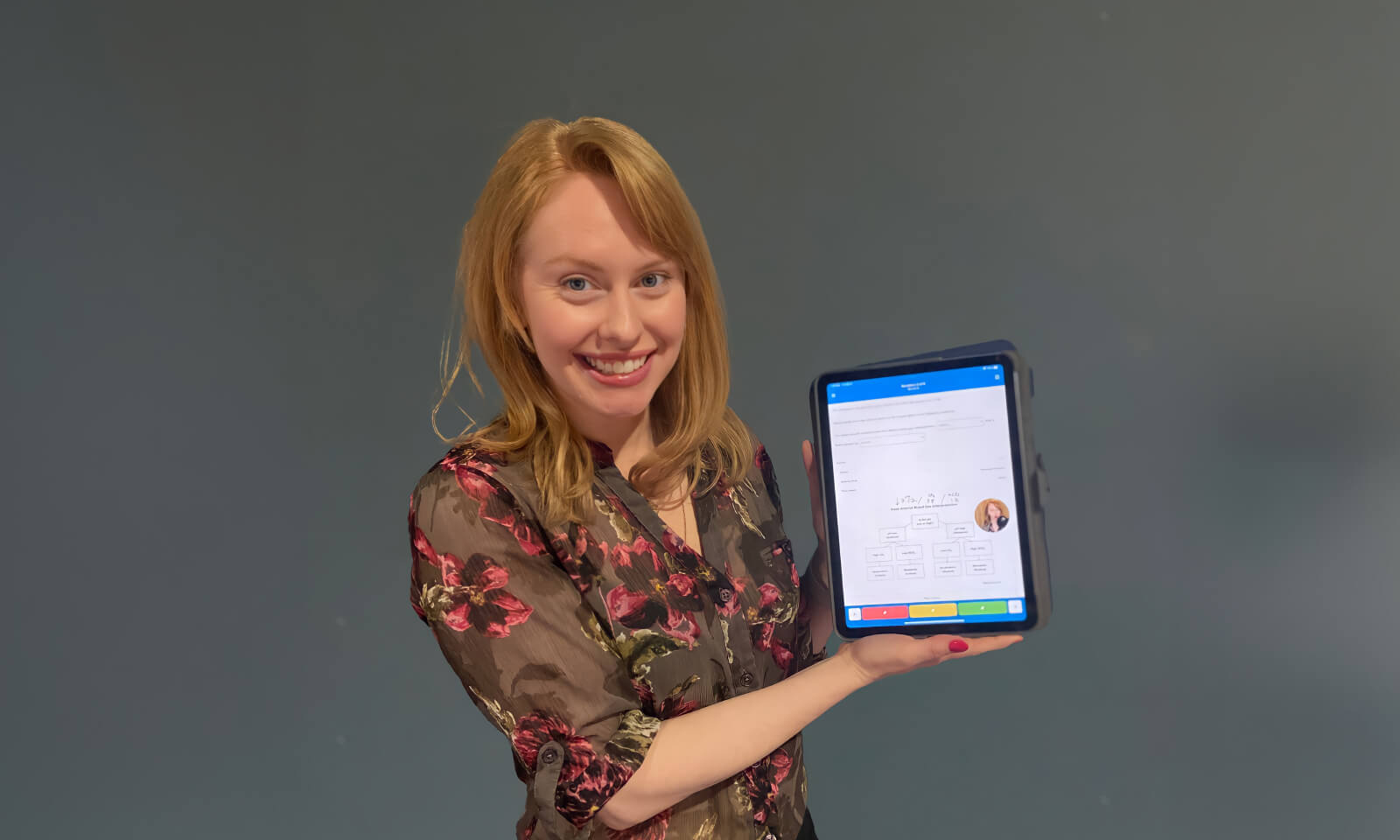 Emily Wilson of NCLEX Bootcamp holding an iPad