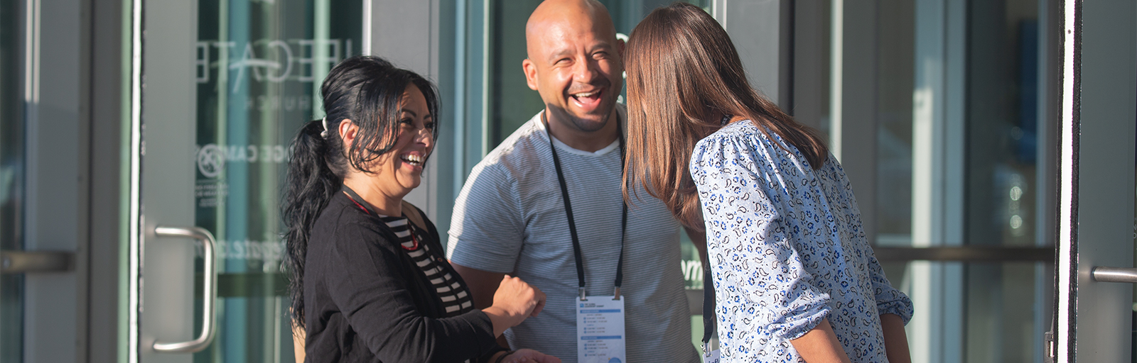Happy people talking in front of Lifegate Church