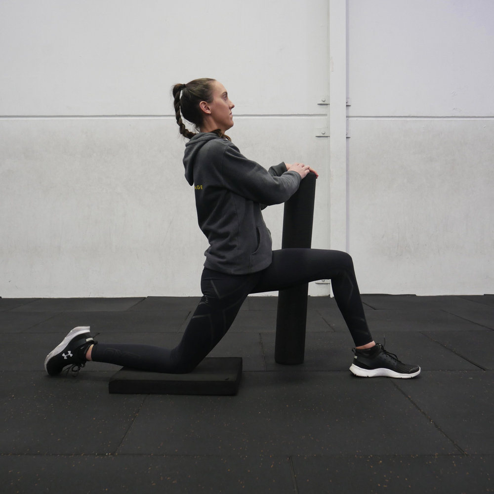 The kneeling hip flexor stretch done poorly. Core relaxed, lower back arched, hips pushed too far fowards
