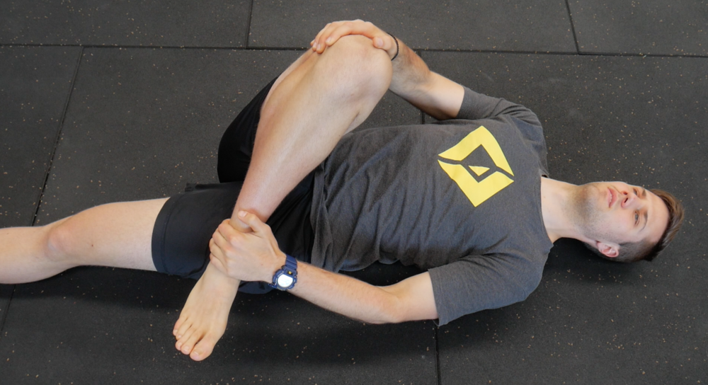 Lying glute med stretch
