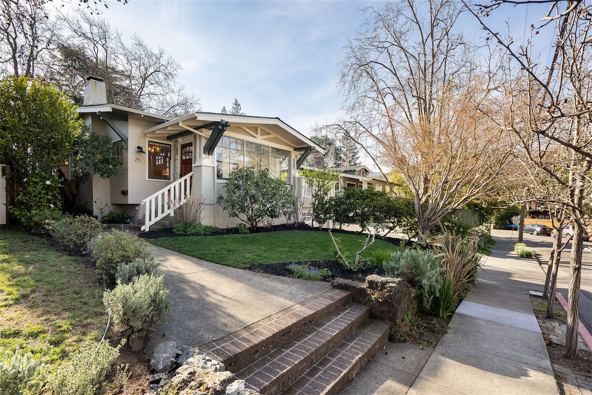 Front of a white bungalow style home
