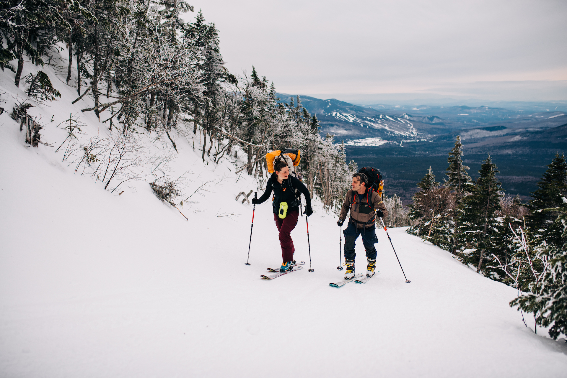 couple uphill skiing new hampshire