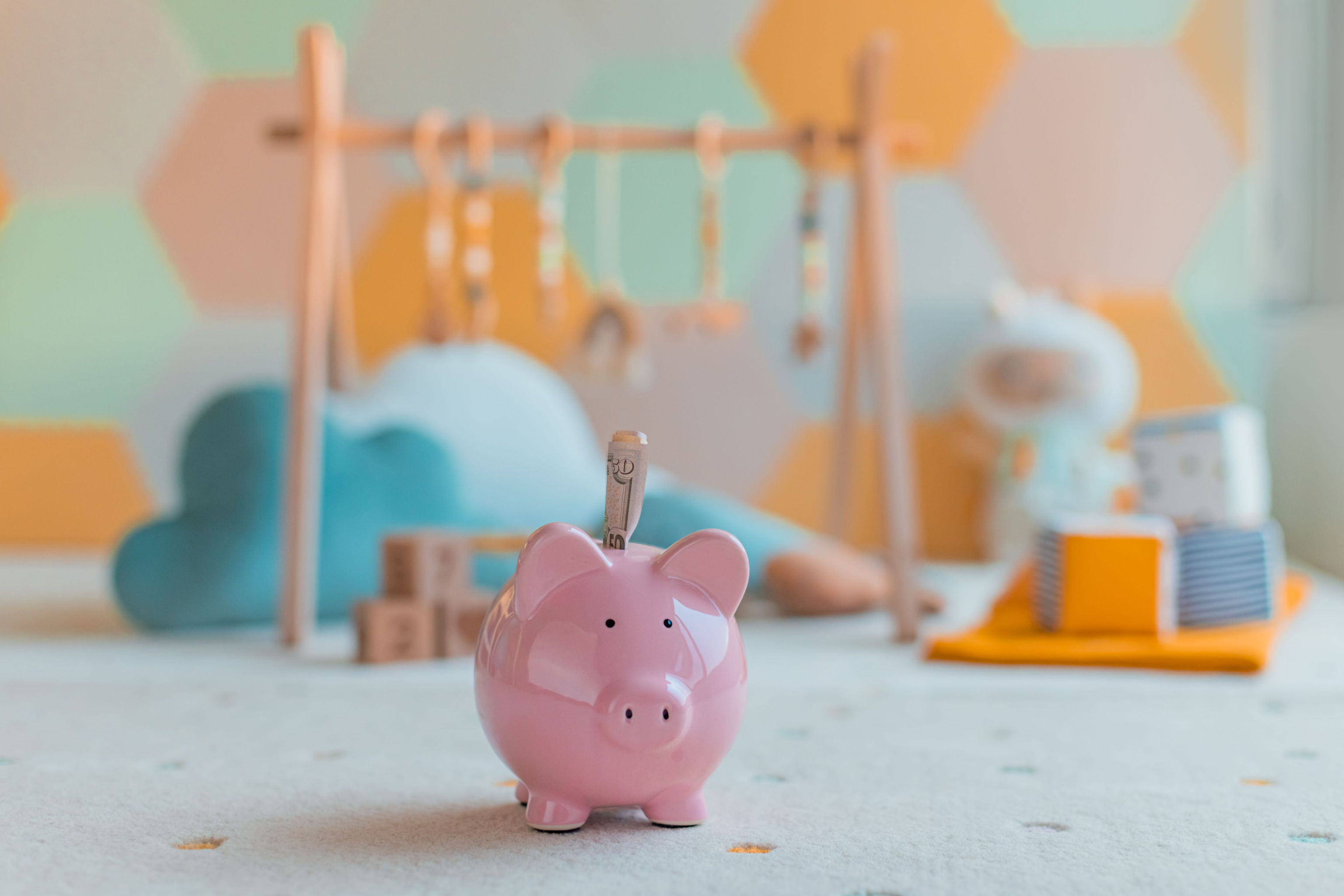 Piggy bank savings for having kids. Pregnancy family planning budget. Cost of having a child. 