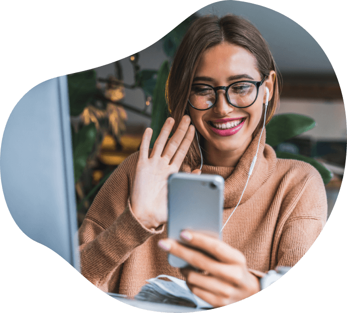 Image of a lady using a mobile phone on a video call.